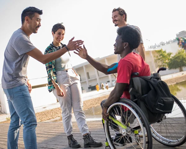 people greeting Diverse friends enjoying time outdoors together